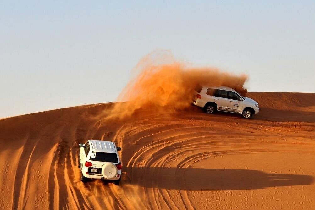 Dune bashing across the golden dunes of the Dubai desert